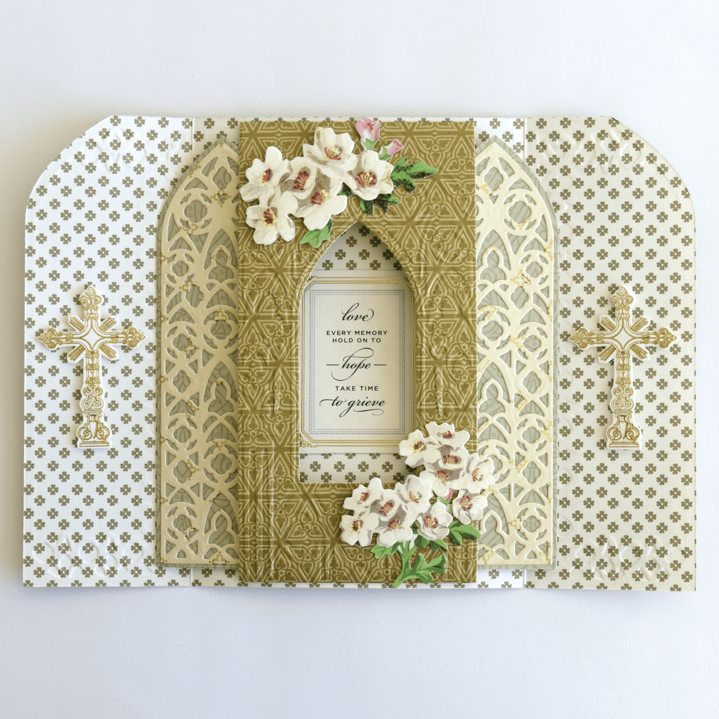 a card with flowers and a cross on it.