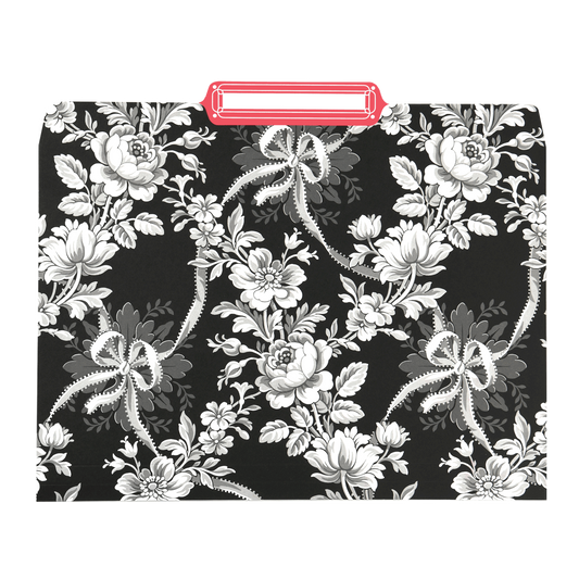 a black and white floral pattern with a red handle.