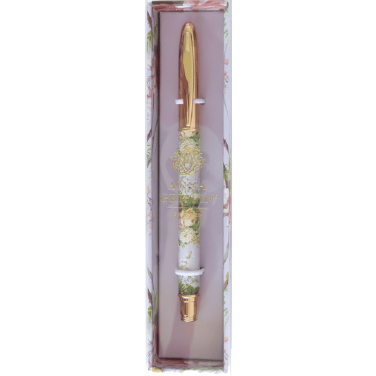 a pink and gold pen in a box.