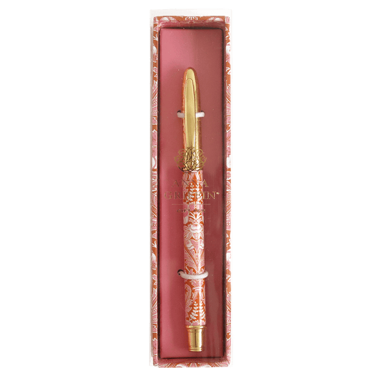 a pink and gold pen in a box.