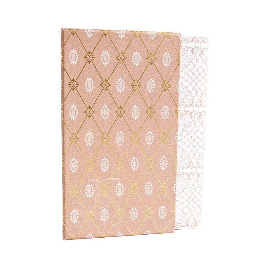 a pink and white paper with gold foil on it.
