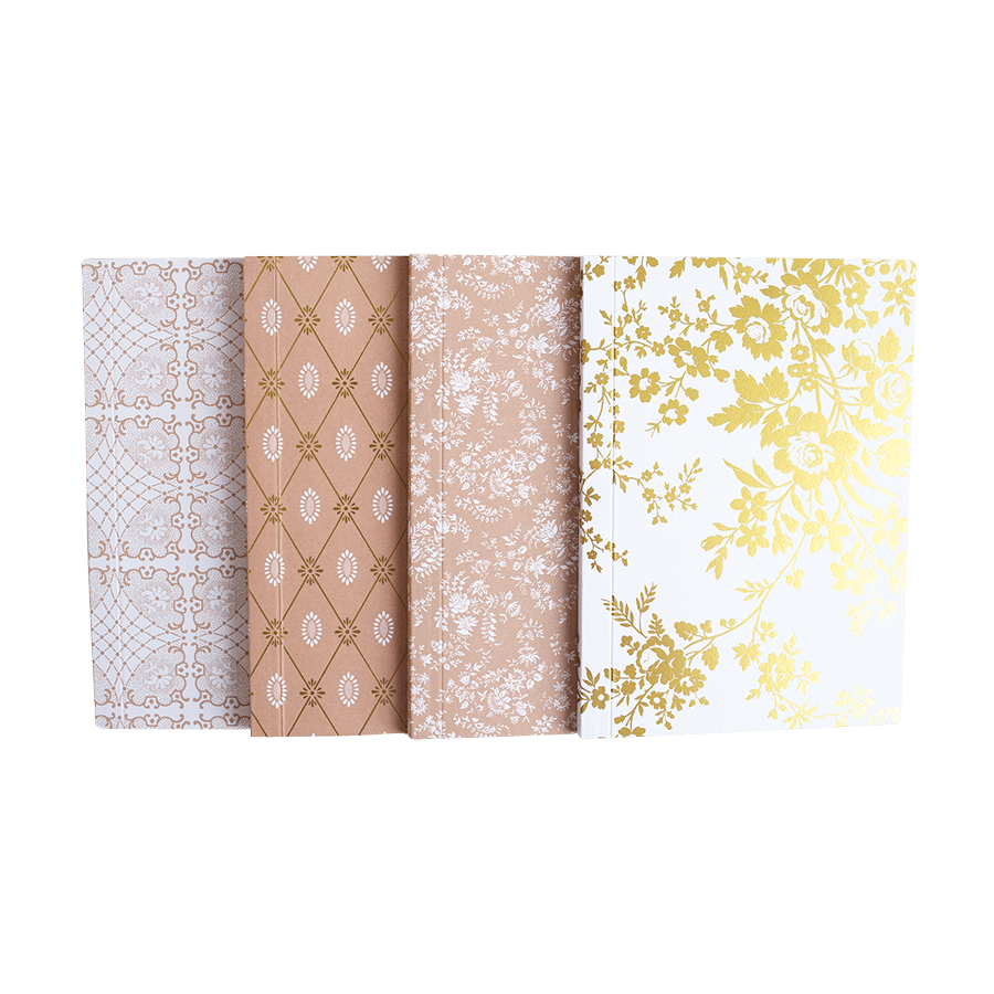 a set of four different colored papers on a green background.