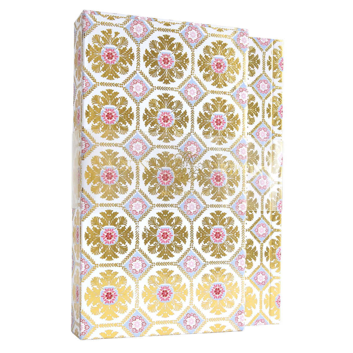 a white and gold book with a floral pattern.