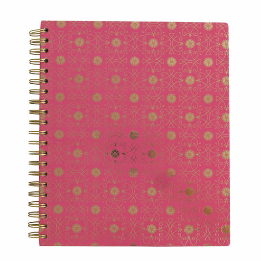a pink notebook with gold foil on it.
