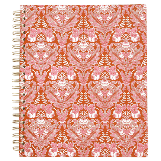 a notebook with a red and white pattern on it.