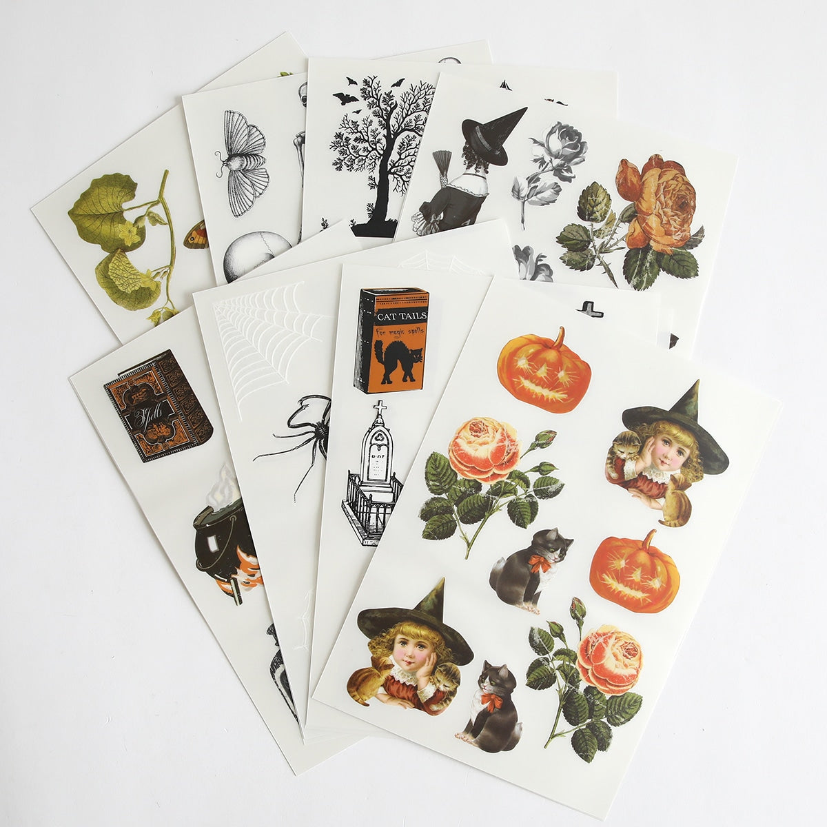 a collection of halloween stickers on a white surface.