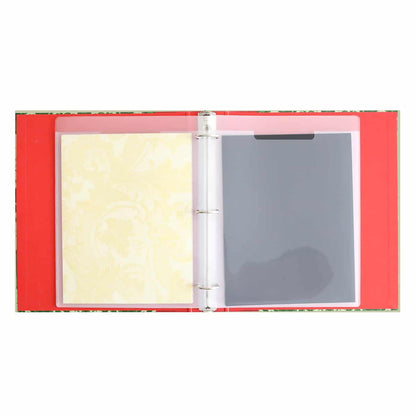 A Holiday Die Storage Binder with a sheet of paper in it.