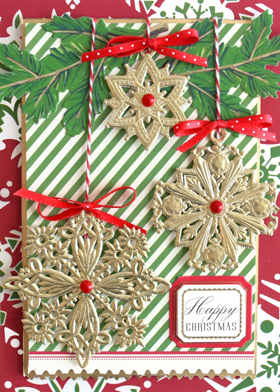 a christmas card with snowflakes and holly.