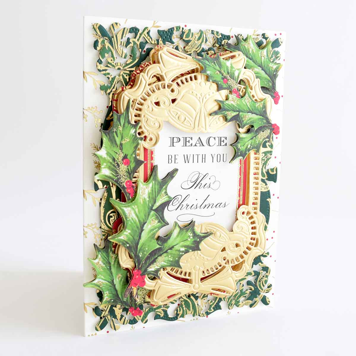a christmas card with a picture of a wreath.