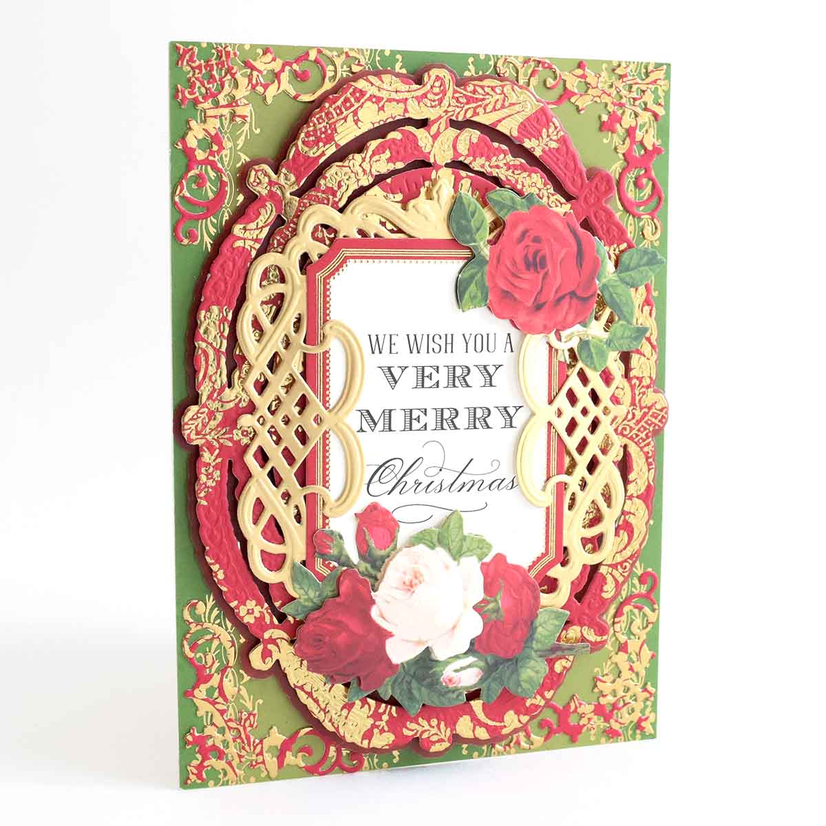 a handmade christmas card with a red rose.