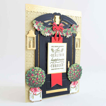 a handmade christmas card with a red ribbon.