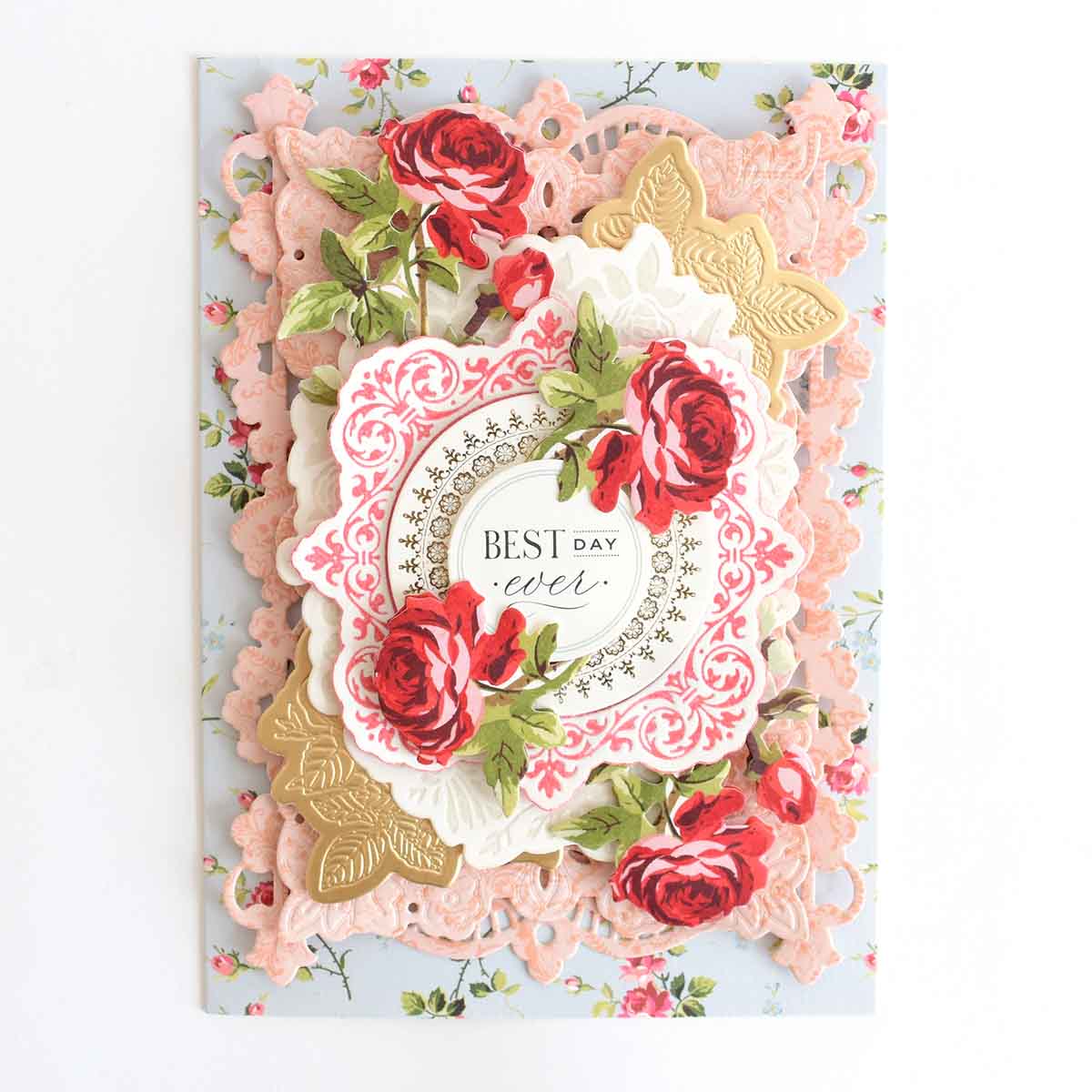 a handmade card with roses on it.