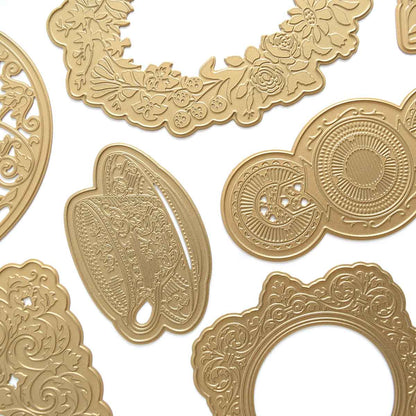 a collection of gold embellishments on a white background.
