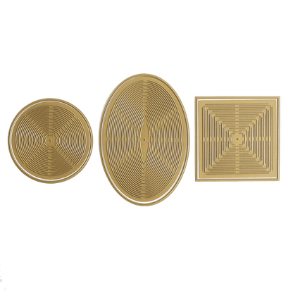a green background with three gold plates with designs on them.