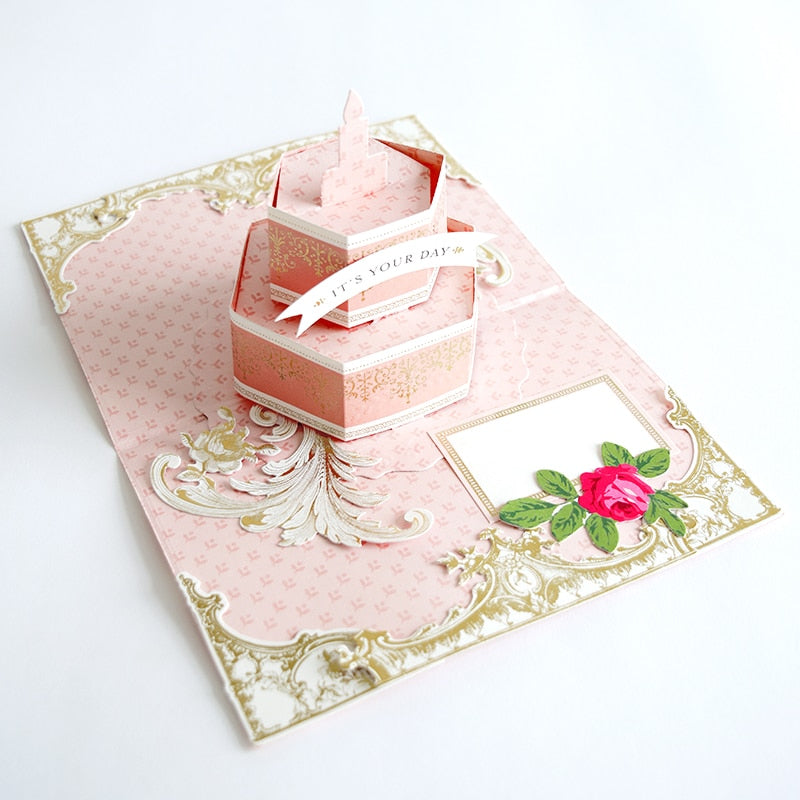 a pink card with a pink rose on it.