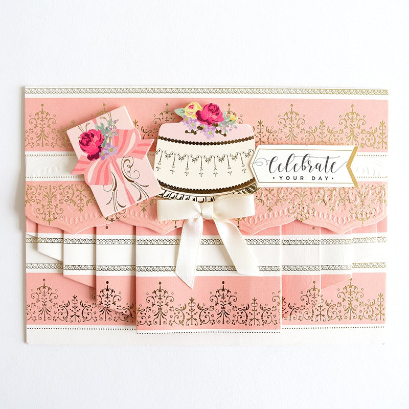 a card with a cake on top of it.