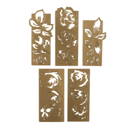 a set of four metal plaques with flowers on them.