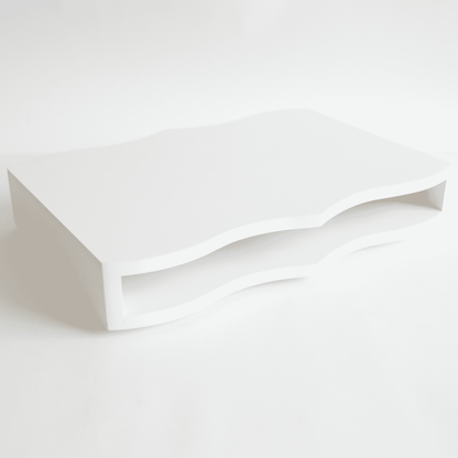 a white table sitting on top of a white table.