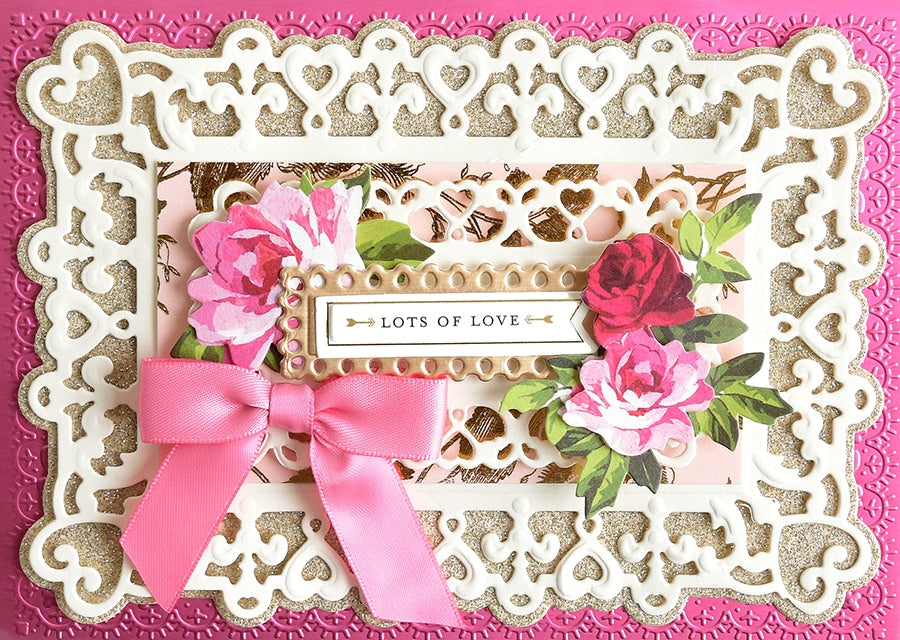 a close up of a card with a pink ribbon.