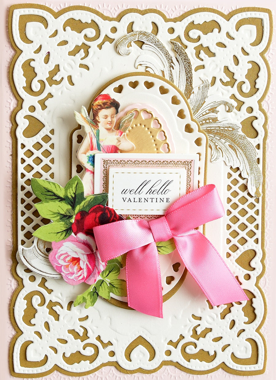 a close up of a card with a pink ribbon.