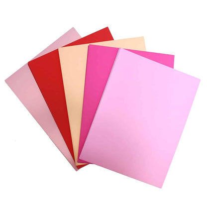 a stack of pink and red cards on a white background.