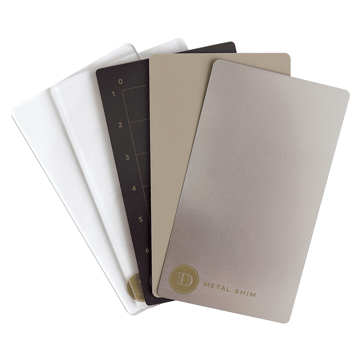 a set of four notebooks sitting next to each other.