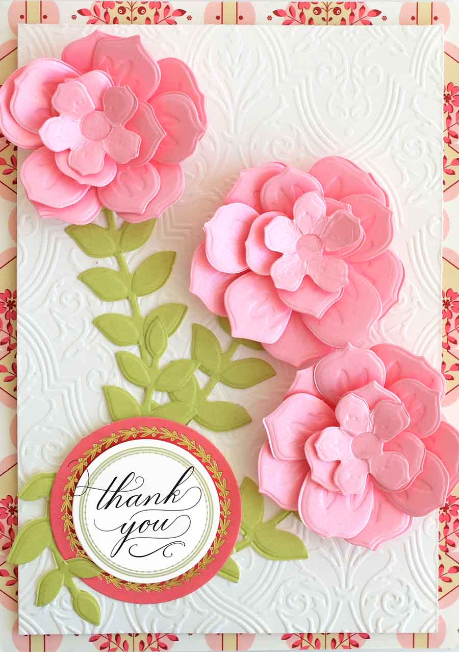 a thank card with pink flowers on it.