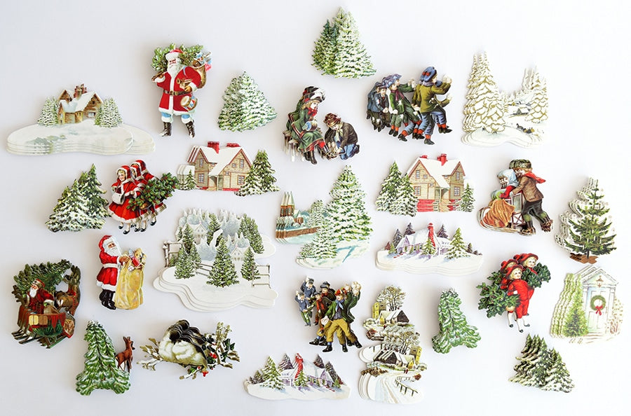 a collection of christmas decorations on a white surface.