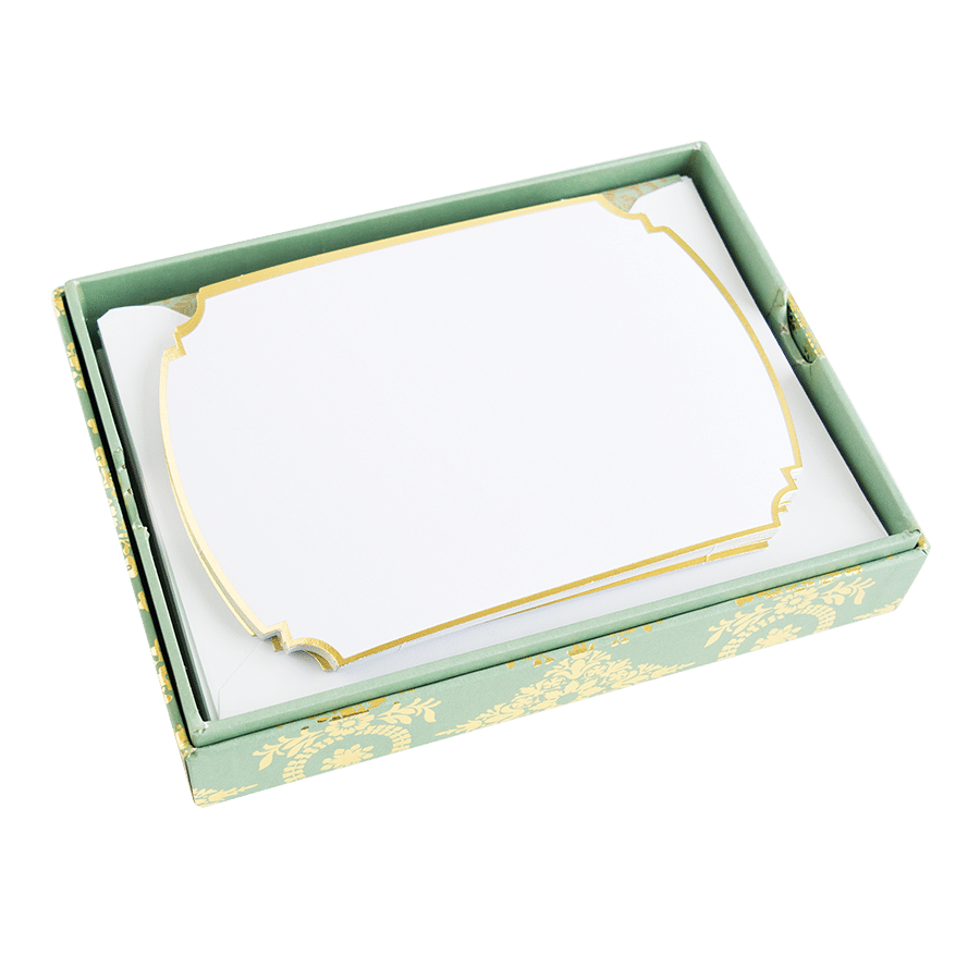 a green and white box with a gold trim.