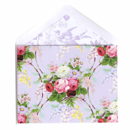 a white envelope with pink and red flowers on it.