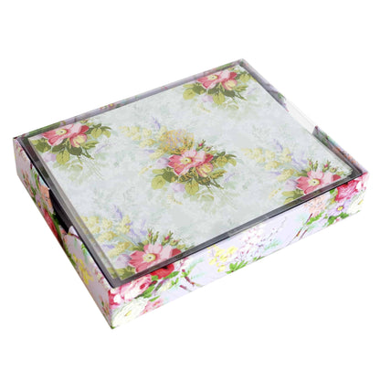 a white box with a floral design on it.