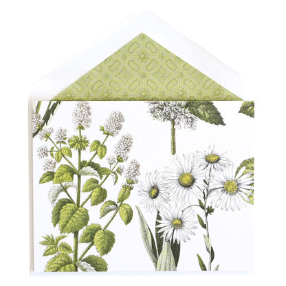 a card with a green and white floral design.