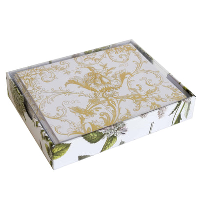 a white and gold box with a floral design.