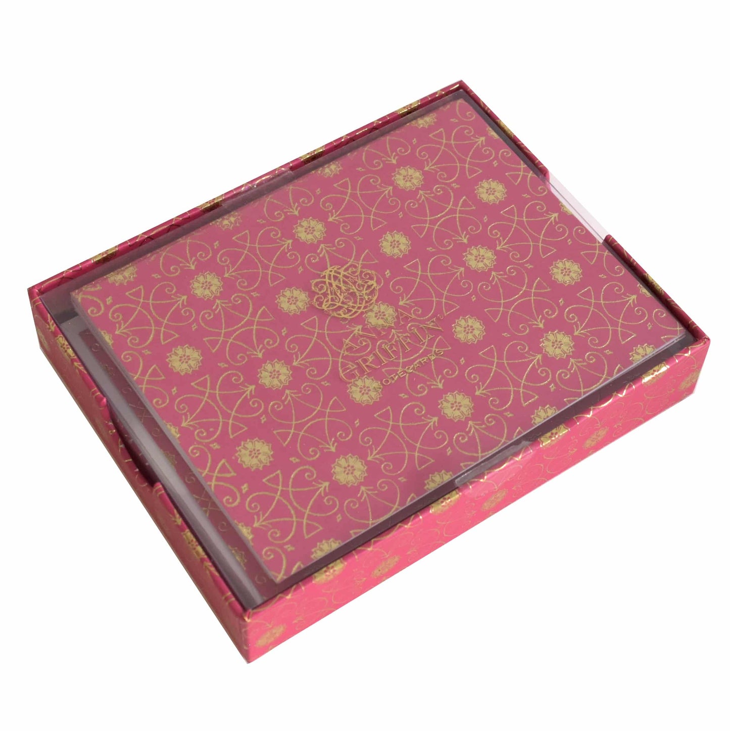 a pink box with gold designs on it.