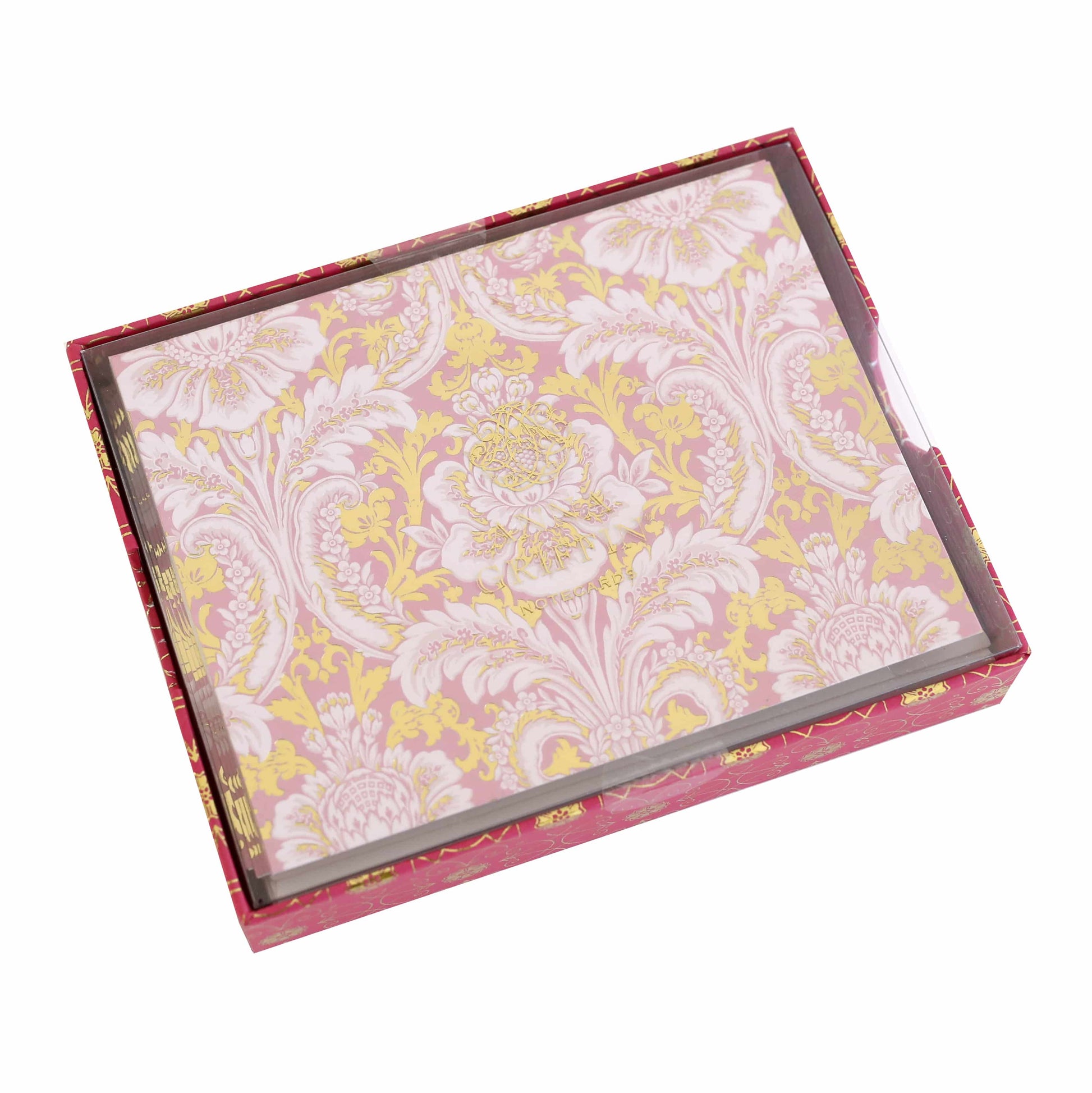 a pink and yellow box with a flower pattern on it.