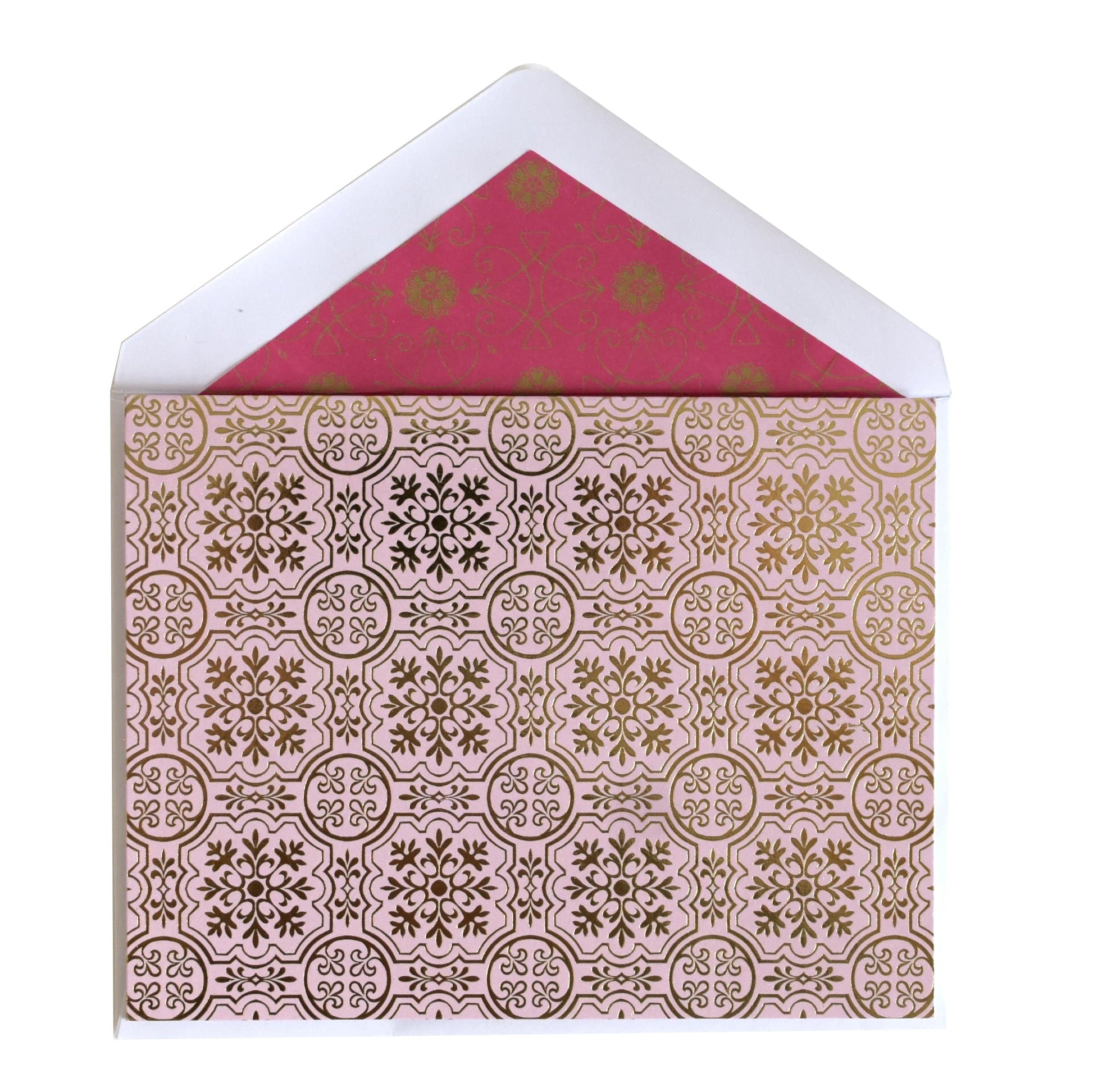 a pink and gold card with a white envelope.