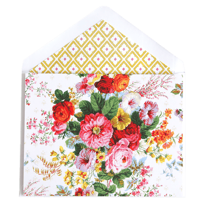 a white envelope with a bouquet of flowers on it.