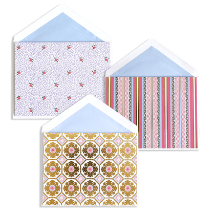 three envelopes with different designs on them.