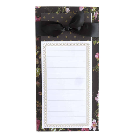 a notepad with a black bow on it.