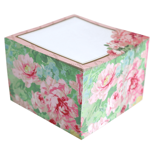 a pink and green box with flowers on it.