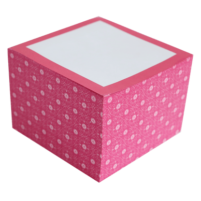 a pink box with white dots on it.