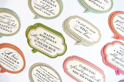 a table topped with lots of different types of labels.