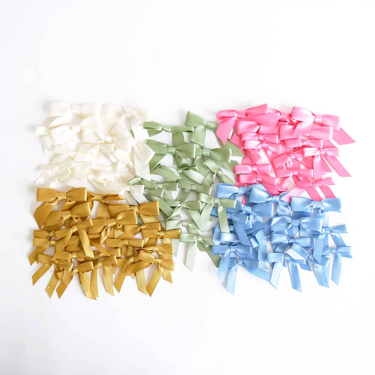 a group of different colored bows on a white background.