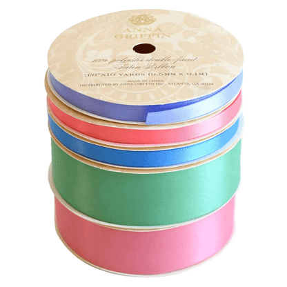 a stack of colorful ribbons on a white background.