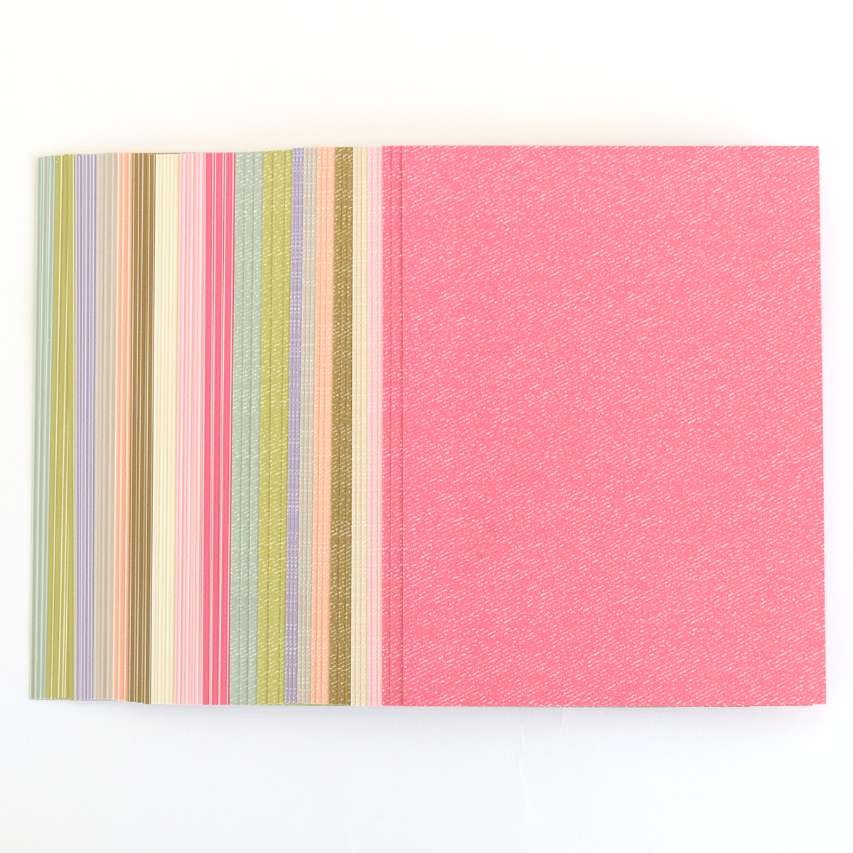a close up of a book with a pink cover.
