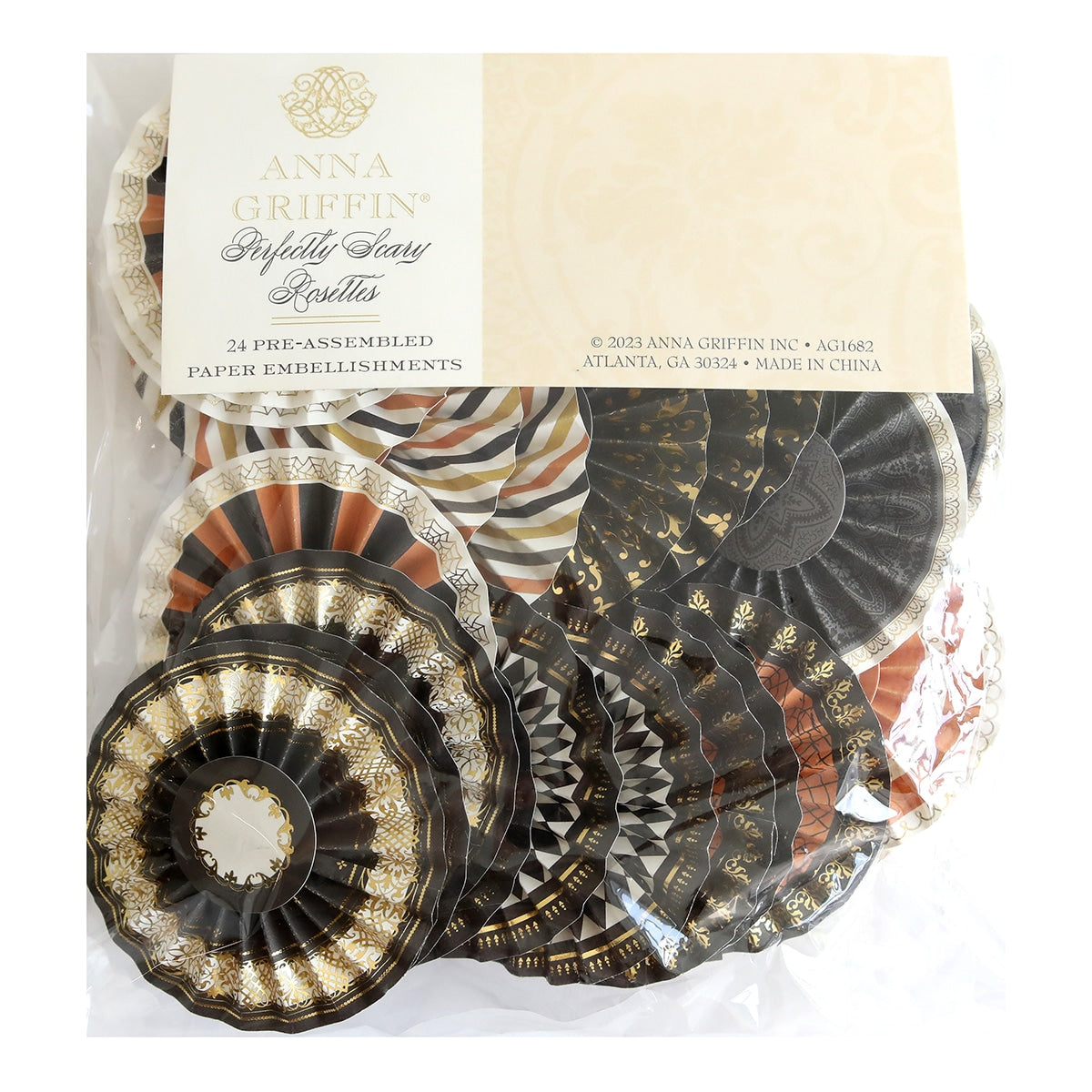 A bag of Perfectly Scary Rosettes with gold and black designs.