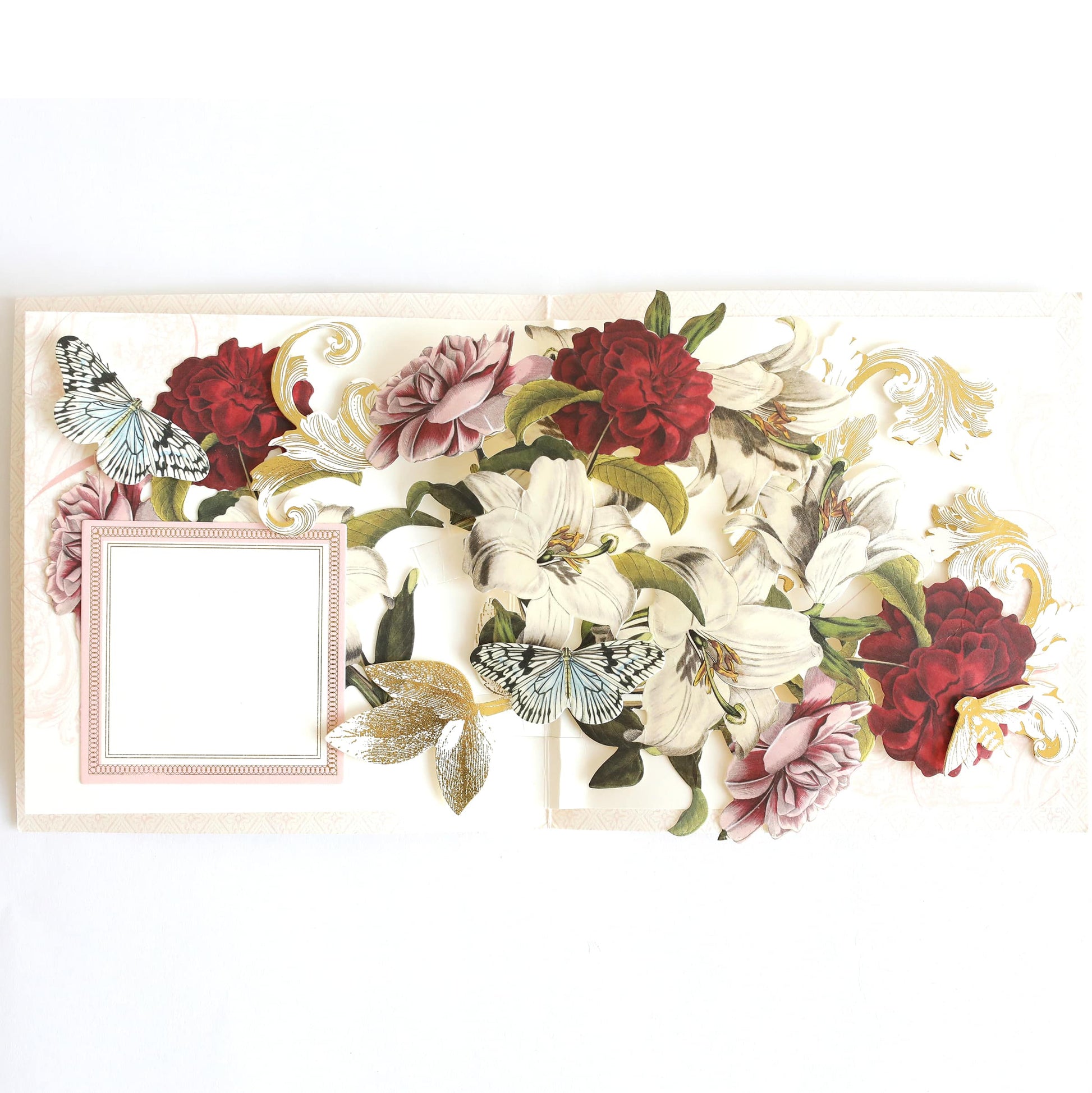 a picture frame decorated with flowers and butterflies.