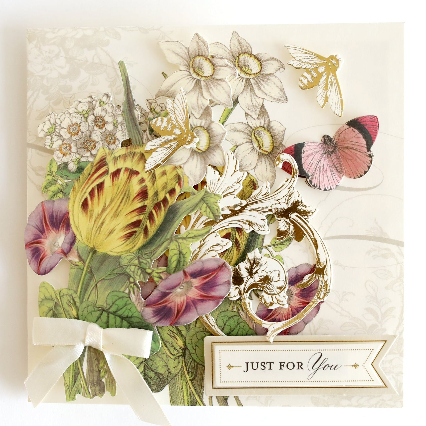 a card with flowers and butterflies on it.