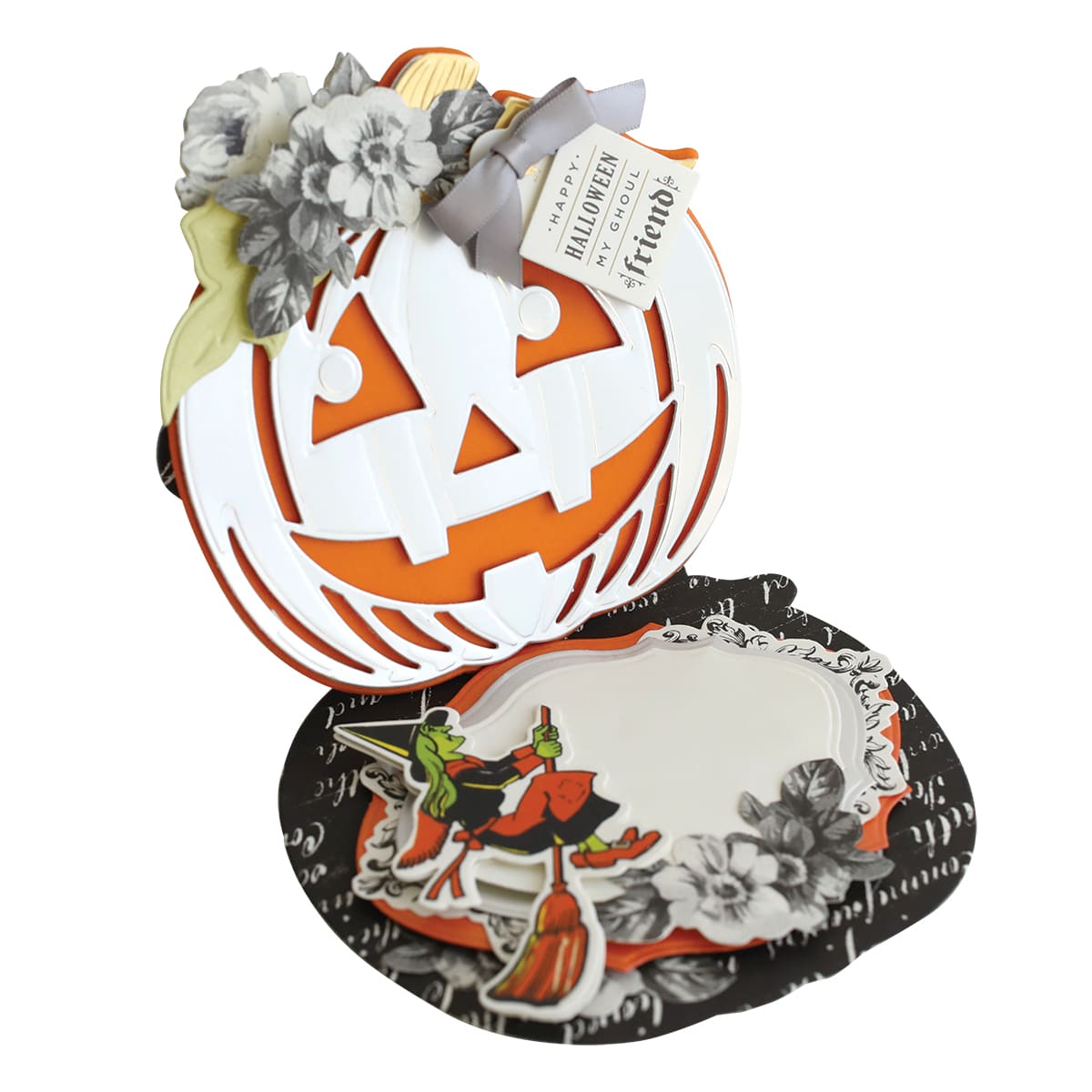 a halloween pumpkin shaped box sitting on top of a plate.