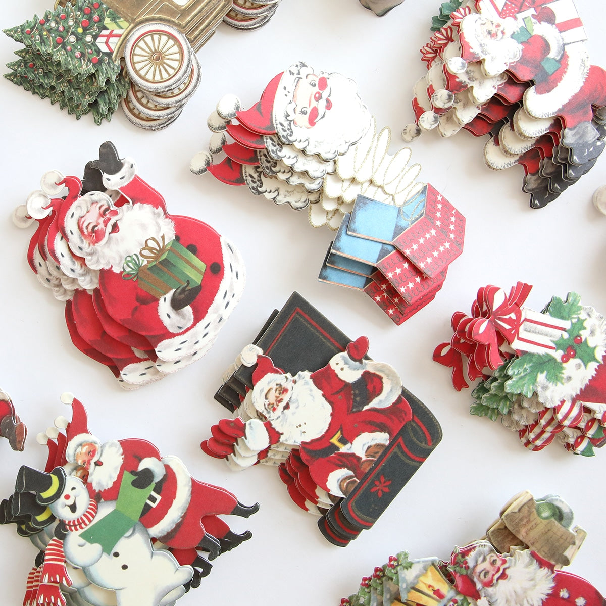 A collection of Retro Santa Sticker Bundle decorations on a white surface.